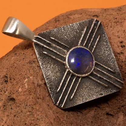 Cast Silver Zia Symbol Pendant with Blue Spiderweb Opal
