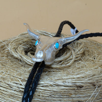 Sterling Silver Cattle Skull Bolo Tie with Sleeping Beauty Turquoise Cabochons - by James Rogers